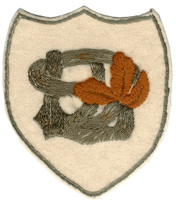 Broderet emblem med initialerne JSD